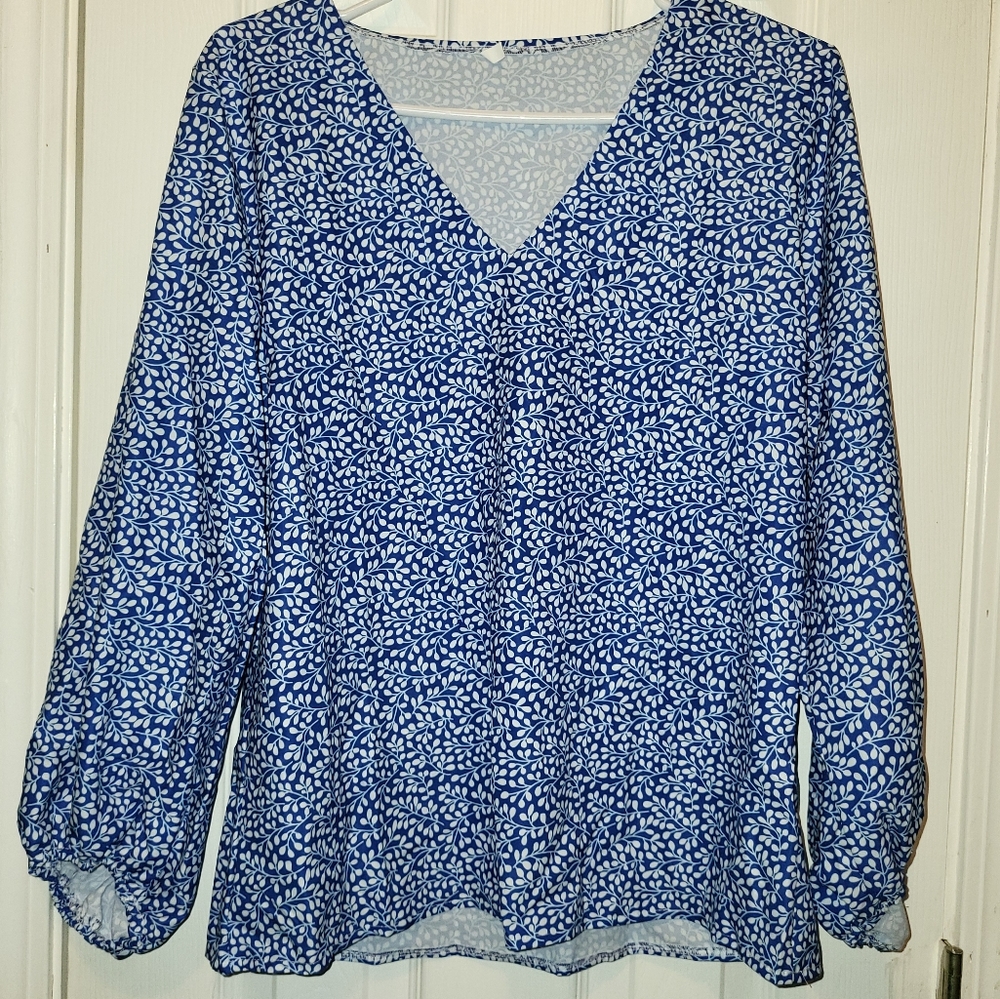 New Blue floral shirt runs small!